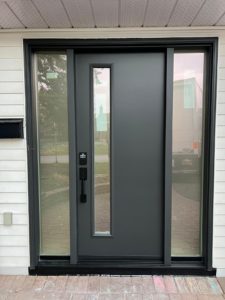 Black modern door with two sidelights, enhancing home design with elegance and sophistication