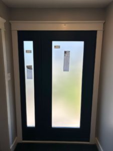 A black door with privacy glass for EcoTech Windows and doors best window company in Ontario