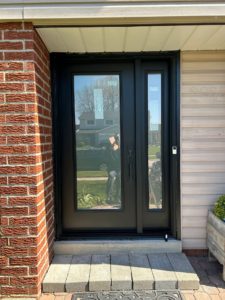 A black door with privacy glass for natural light on side