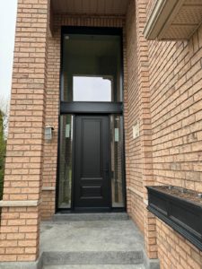 A black door with privacy glass for natural light on sides and Top