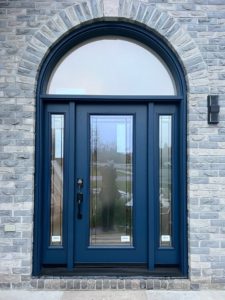 A blue door with privacy glass for natural light on sides and Top