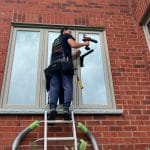 installer-on-a-brickmold-home-e1723750062375